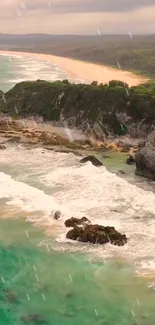 Rain-drenched coastline with waves and cliffs.