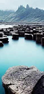 Scenic view of coastal rock formations by the calm blue sea.