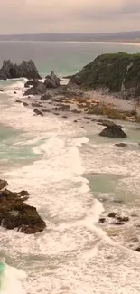 Majestic coastal scenery with waves and rocks along the shoreline.