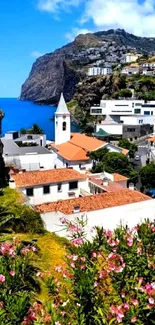 Scenic coastal village with ocean view and vibrant rooftops.