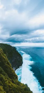 Scenic coastline with blue ocean and lush green cliffs under dramatic clouds.