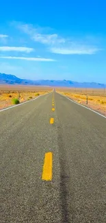 Endless desert highway with blue skies stretching to the horizon.