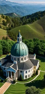 Dome building surrounded by lush green hills in a scenic landscape.