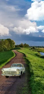 Vintage car on winding rural road with scenic countryside view.