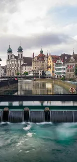 Charming European river city with historic architecture and serene water scene.