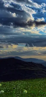 Stunning evening mountain view wallpaper with dramatic cloudy sky.