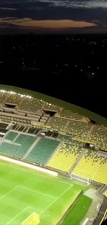 Aerial view of illuminated football stadium at night.