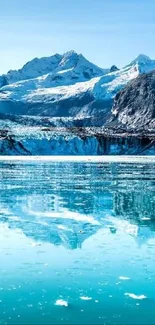 Serene glacier lake with mountains and blue sky