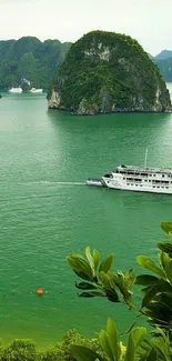 Scenic view of a green bay with a boat and lush islands.