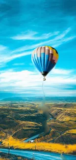 Colorful hot air balloon over scenic view.