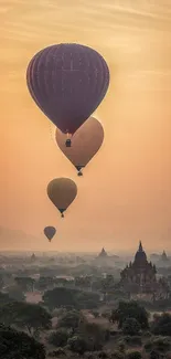 Hot air balloons at sunset over ancient temples.