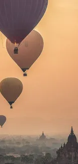 Hot air balloons at sunrise over ancient cityscape, warm tones.