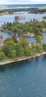 Aerial view of a castle on a lush green island surrounded by calm water.