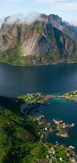 Aerial view of island with mountains and blue water.