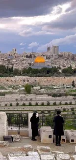 Jerusalem skyline featuring the Dome of the Rock with cloudy skies.