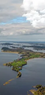 Aerial view of serene lake with green islands under a dramatic cloudy sky.