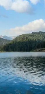 Tranquil lake with mountain background under a bright blue sky.