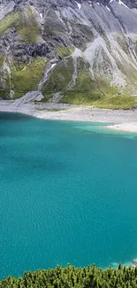 Turquoise lake with mountain backdrop in scenic nature wallpaper.