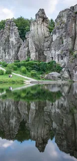 Serene natural landscape with lake and rock formations.