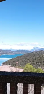 Scenic lake and landscape view through an archway.