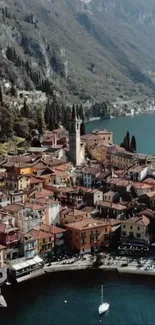 Aerial view of a picturesque lakeside village nestled between mountains and a serene lake.