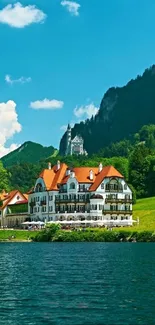 Lakeside view with a castle and lush green hills under a clear blue sky.