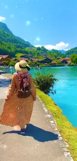 Woman walking by a bright blue lake with green hills, wearing a hat and backpack.