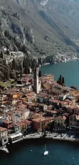 Aerial view of a charming lakeside town with mountains.