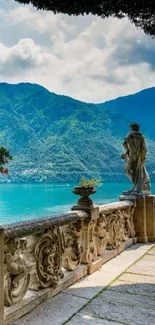 Serene lakeside view with mountains and stone terrace.