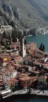 Aerial view of a charming lakeside village nestled among mountains.