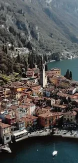 Aerial view of a picturesque lakeside village surrounded by mountains.