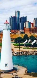 Lighthouse overlooking city skyline with blue waters and cloudy sky.