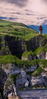 Lighthouse on lush green cliffs with vibrant sky backdrop.