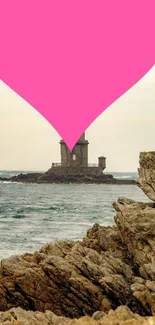 Pink heart over lighthouse on rocky coast.