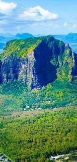 Aerial view of Mauritius island with turquoise waters and lush green landscapes.