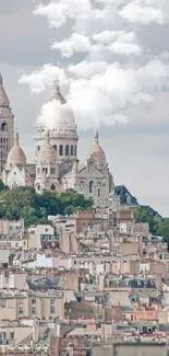 Montmartre houses and Basilica with cloudy sky.