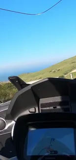 Scenic motorcycle view on coastal road.