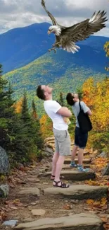 Mountain trail with vibrant foliage and soaring eagle.