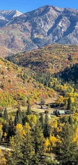 Vibrant autumn landscape with mountains and colorful trees on a sunny day.