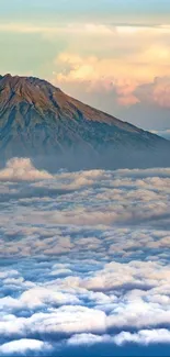 Majestic mountains rising through the clouds at sunrise, showcasing vibrant colors.