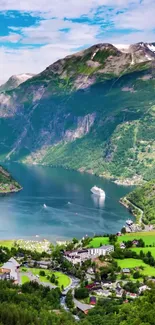 Scenic view of a peaceful fjord among towering mountains and lush green hills.