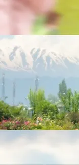 Scenic view of snow-capped mountains and a lush garden.