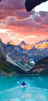 Kayaker on turquoise lake with mountain view at sunset background.