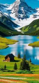 Scenic mountain lake with cabin and snowy peaks.