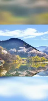 Tranquil mountain lake scene with blooming trees and clear blue sky.