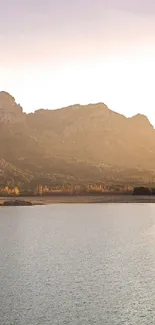 Tranquil mountain lake with sunset view enhancing a mobile wallpaper.