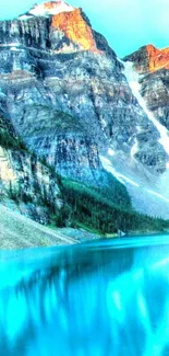 Scenic view of a turquoise mountain lake with rocky peaks.