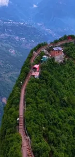 Aerial view of a scenic mountain path with lush greenery.