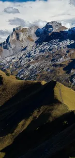 Scenic mountain range under dramatic sky.