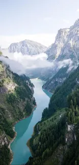 A stunning view of a river through mountains with lush greenery.